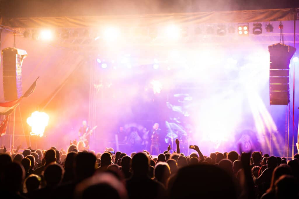 Crowd at a concert with stage lights
