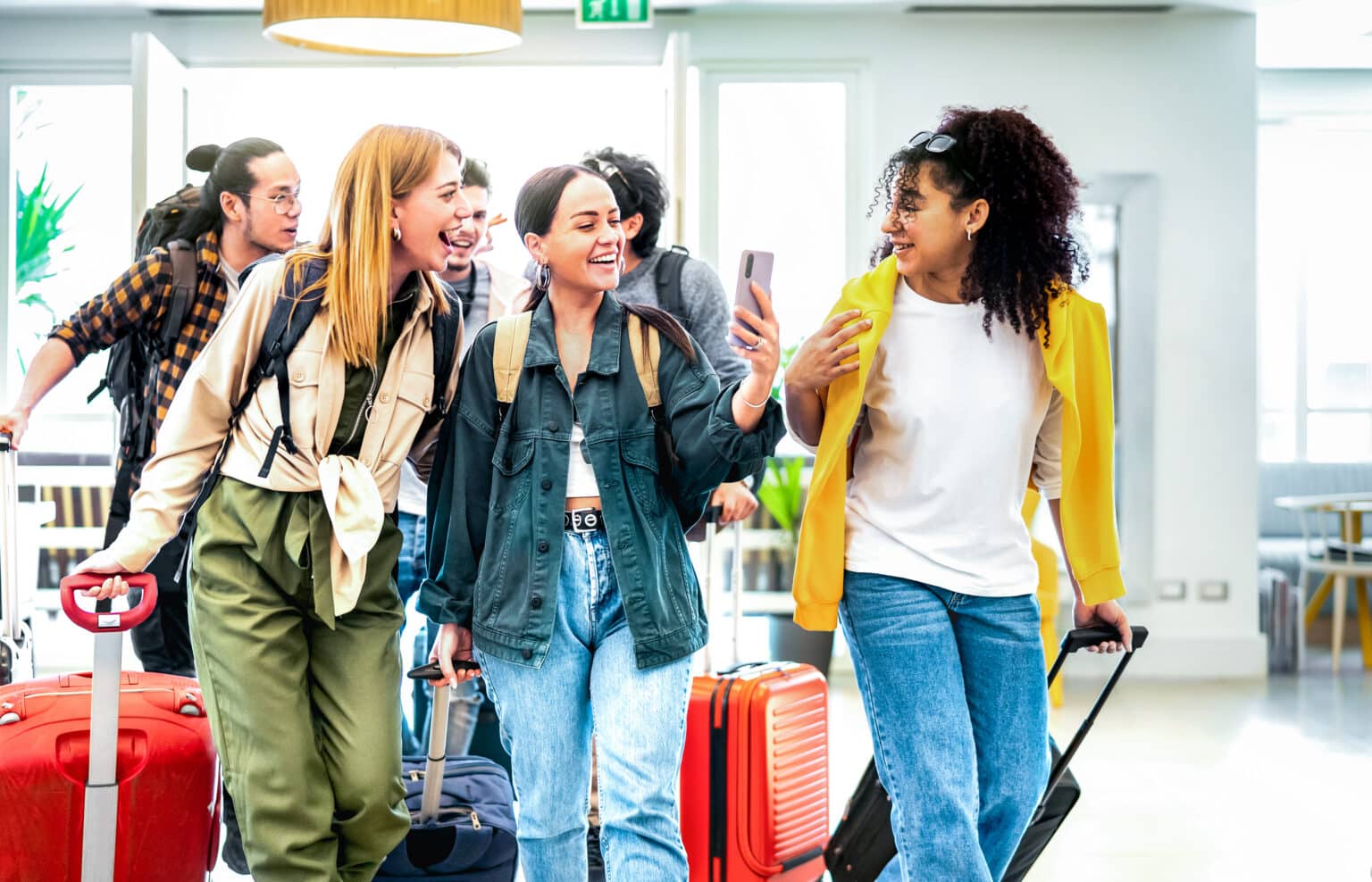 Group of international students arriving with their luggage