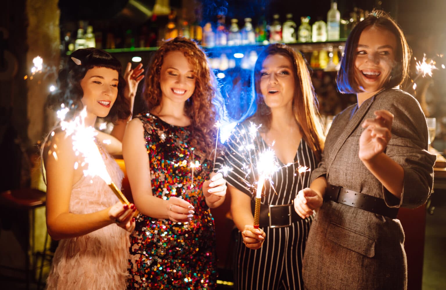 Three friends with champagne glasses on a hen night