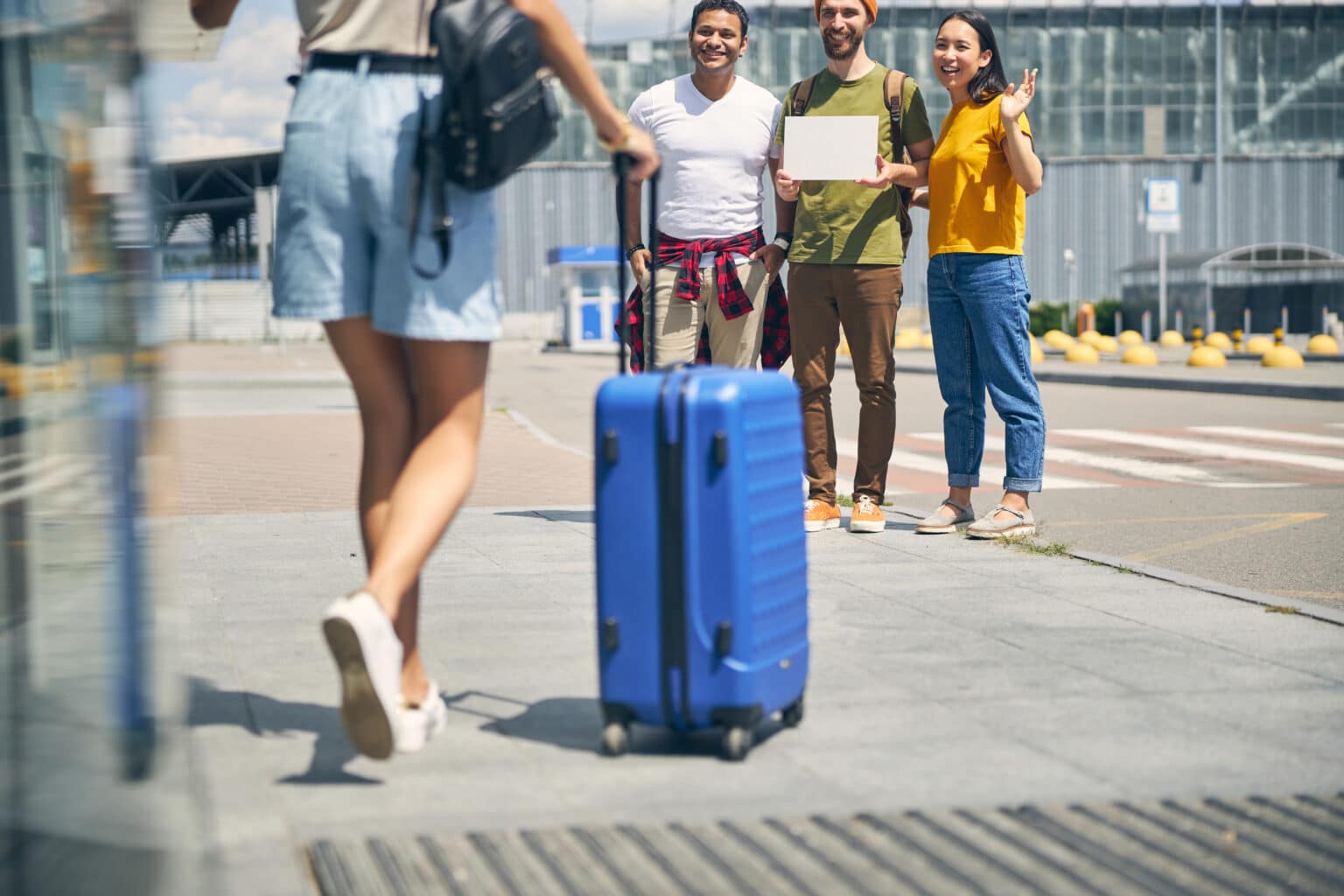 Student with a blue suitcase setting off on a journey