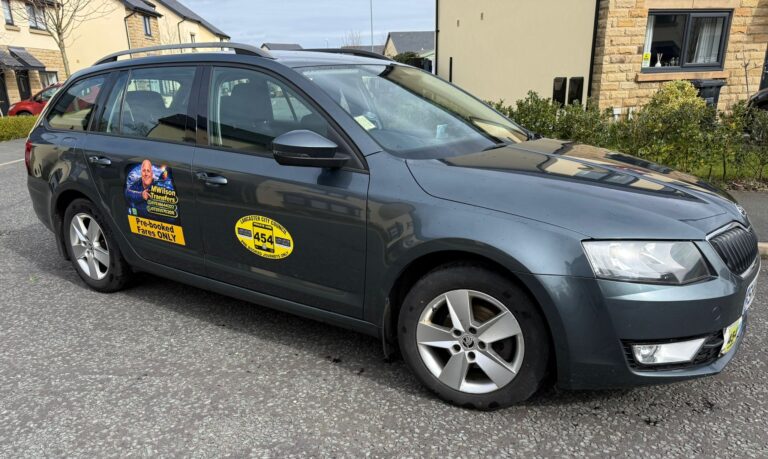 MW Transfers Skoda Octavia parked outside a house