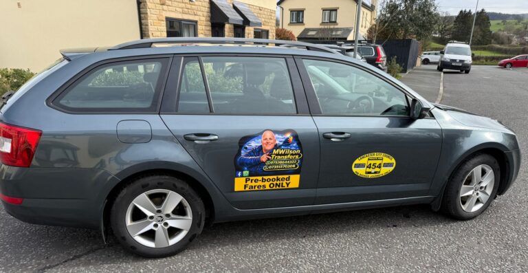 MW Transfers Skoda Octavia with its door signs