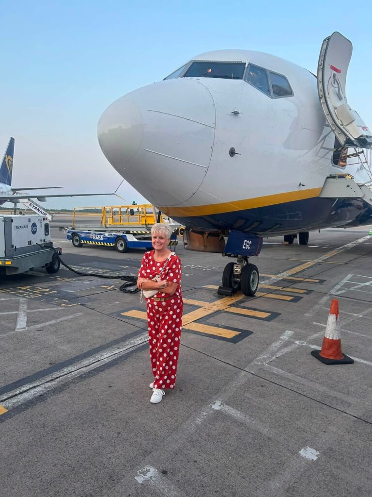 MW Transfers customer in front of her plane